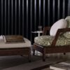 Virginia Outdoor outdoor armchair | Minotti. Elegant outdoor armchair, offering comfort with plush cushions and durability with a solid Iroko frame; well-suited for both small spaces and hospitality needs.