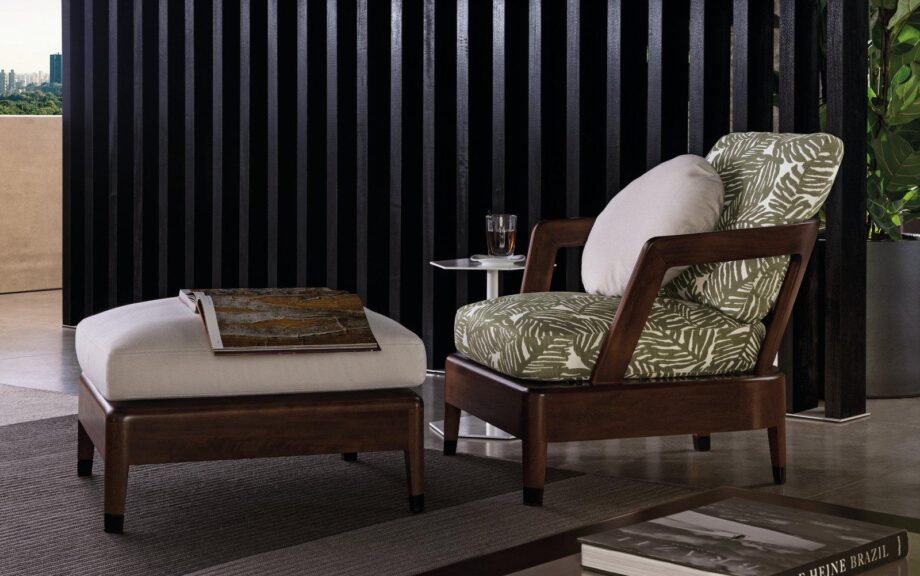 Virginia Outdoor outdoor armchair | Minotti. Elegant outdoor armchair, offering comfort with plush cushions and durability with a solid Iroko frame; well-suited for both small spaces and hospitality needs.