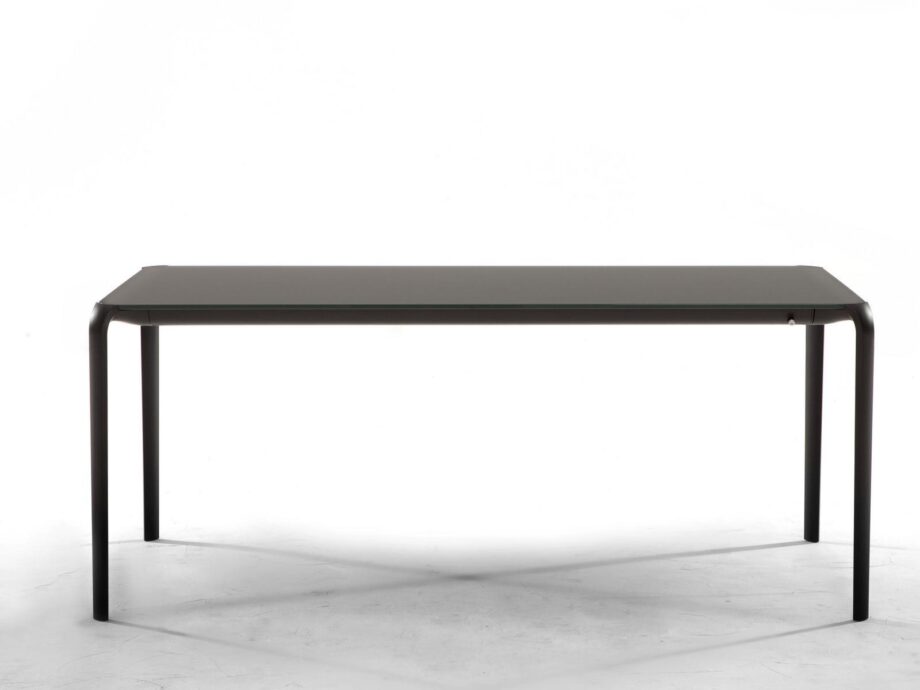 Light table | Tonin Casa. Functional and spacious table with extendable features for large gatherings, offering a sense of modernity and lightness.