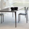 Sol table | Bonaldo. Innovative Sol table with elegant, minimalist design; features slender aluminium legs and versatile style for various room decor; ideal for both work and social settings.