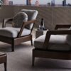 Virginia Outdoor outdoor armchair | Minotti. Elegant outdoor armchair, offering comfort with plush cushions and durability with a solid Iroko frame; well-suited for both small spaces and hospitality needs.