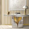 Lapiaz console | Boca Do Lobo. This modern console features an exquisite stone-like crack design with a luxurious polished brass interior, bringing elegance and a unique aesthetic to any space.