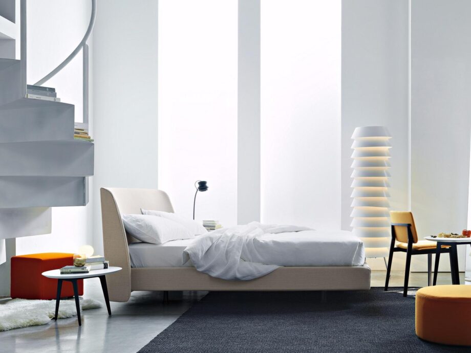 Edel bed | Lema. Dreamy vintage bed with curved headboard, enveloping padding, and velvet details. Custom fabric options available. Luxurious sleep experience.