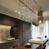 Jackie O Chandelier 6 / 9 / 12 pendant lamp | Catellani & Smith. Stylish pendant lamp with unique design, dimmable LED light source, and innovative thin blue fabric cable.