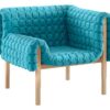 Ruché easy chair | Ligne Roset. Ruché armchair blends traditional quilting, sturdy wooden frame with compact design for comfort and space efficiency in small apartments.