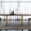 Aston table | Daytona. The Aston table is a luxurious masterpiece blending modern and Art Deco styles. Crafted from marble and stainless steel, it offers elegance and durability.