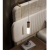 Papillon bed | Carpanese home. Luxurious double bed with an expansive, cushioned headboard and delicately quilted leather and velvet, enhanced by satin brass details.