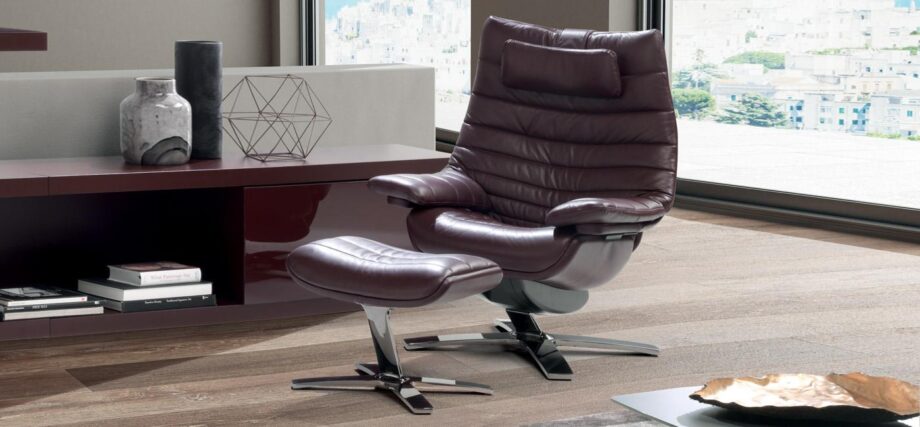 Re-vive Lounge armchair | Natuzzi Italia. The Re-vive Lounge chair intuitively supports seamless movement transitions with a quilted backrest, footrest, and weight compensation recliner function.