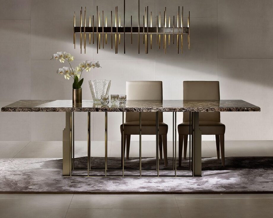 Aston table | Daytona. The Aston table is a luxurious masterpiece blending modern and Art Deco styles. Crafted from marble and stainless steel, it offers elegance and durability.