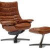 Re-vive Lounge armchair | Natuzzi Italia. The Re-vive Lounge chair intuitively supports seamless movement transitions with a quilted backrest, footrest, and weight compensation recliner function.