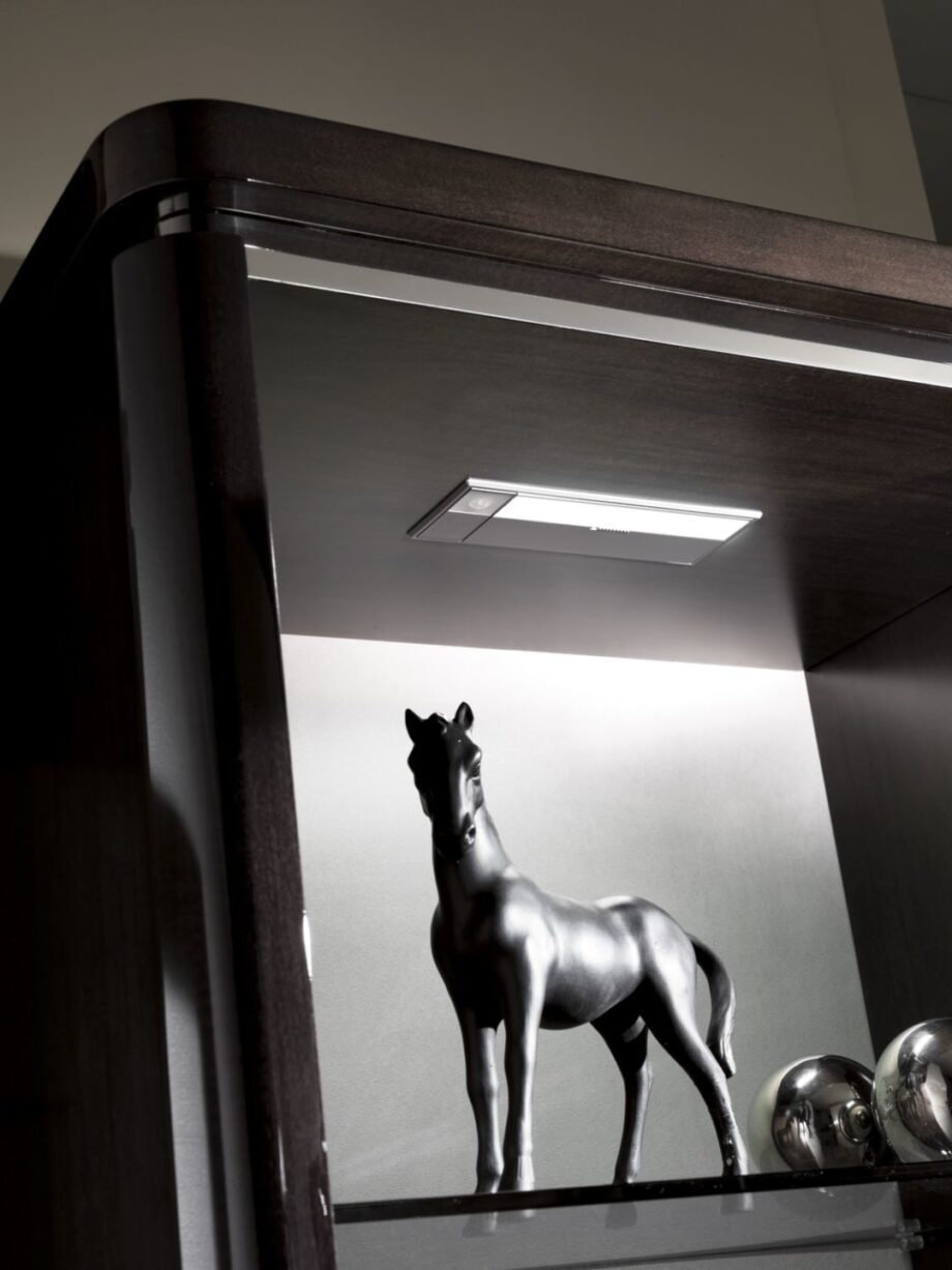 Egoist display cabinet | DV home. Elegant Art Deco display case with integrated lighting, glass shelves, wood, and metal finishes.