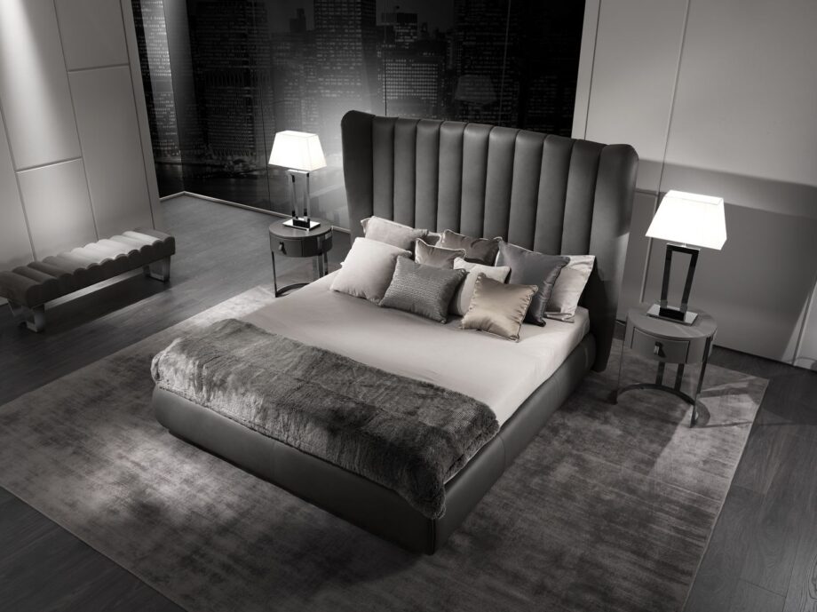 Hermes bed | DV home. Luxurious upholstered bed with a high, vertically tufted headboard, blending Art Deco glamour with contemporary elegance for sophisticated bedrooms.