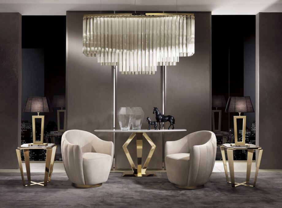 Hermes armchair | DV home. Luxurious Art Deco swivel armchair with a polished stainless steel base, offering supreme comfort and style.