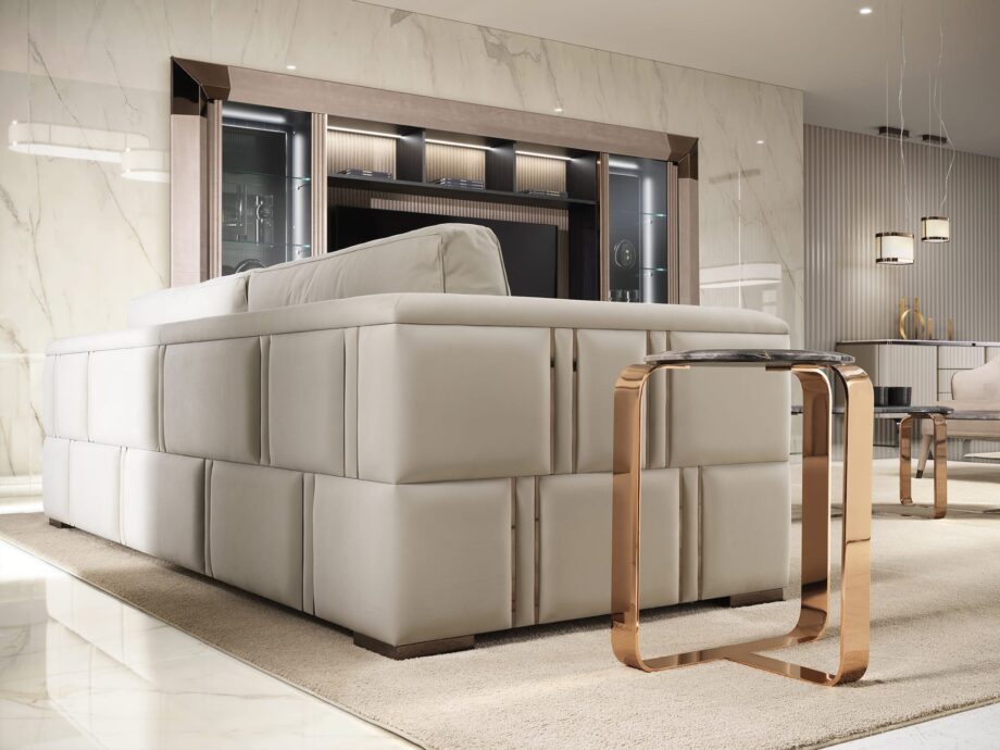 Manhattan sofa | DV home. Luxurious Art Deco sofa with goose feather cushions and a striking steel frame, offering unparalleled comfort and style.
