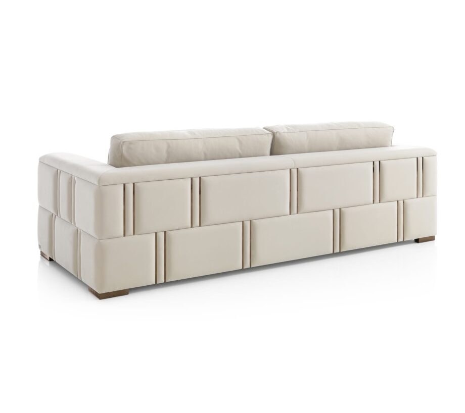Manhattan sofa | DV home. Luxurious Art Deco sofa with goose feather cushions and a striking steel frame, offering unparalleled comfort and style.