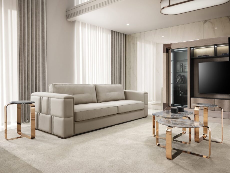 Manhattan sofa | DV home. Luxurious Art Deco sofa with goose feather cushions and a striking steel frame, offering unparalleled comfort and style.