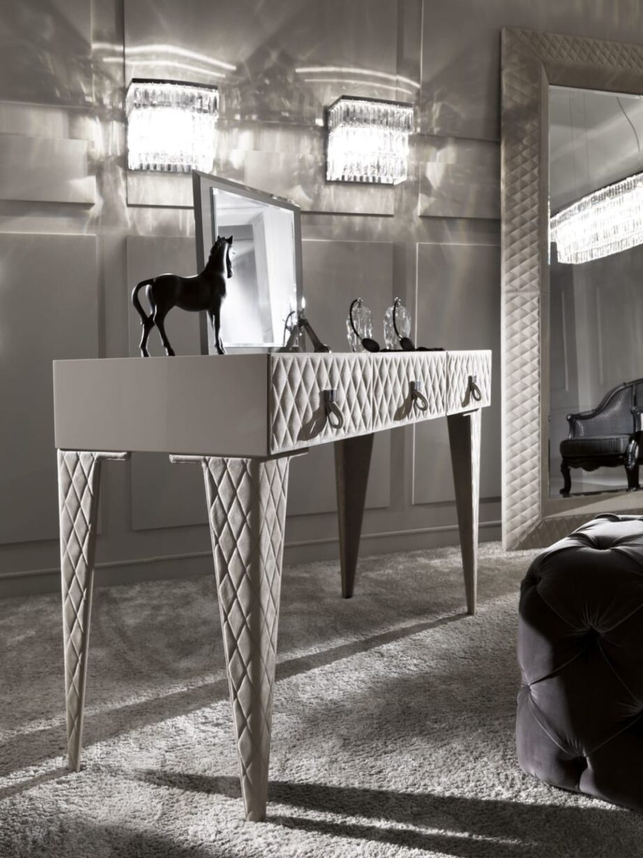 Byron wall lamp | DV home. An exquisite Art Deco wall lamp featuring a polished chrome brass structure adorned with dazzling bevelled crystal pendants.