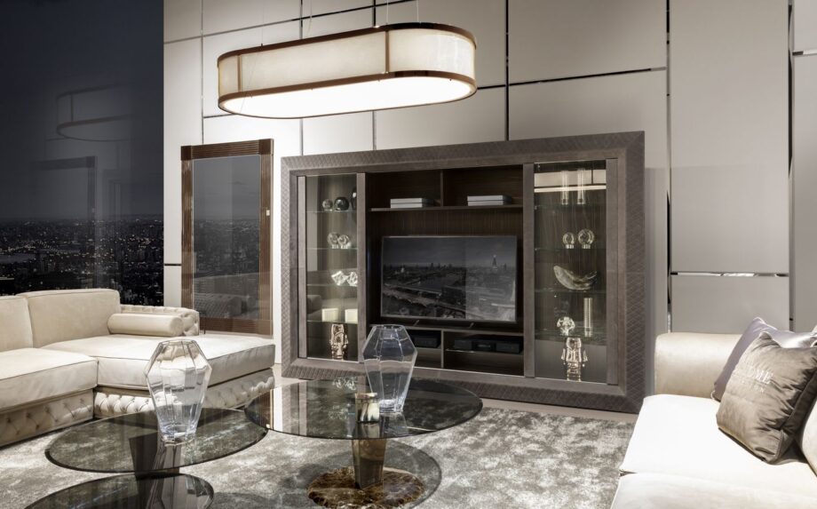 Byron Glass display cabinet | DV home. Elegant TV unit featuring Macassar ebony veneer, quilted leather, tempered glass sliding doors, and integrated lighting.
