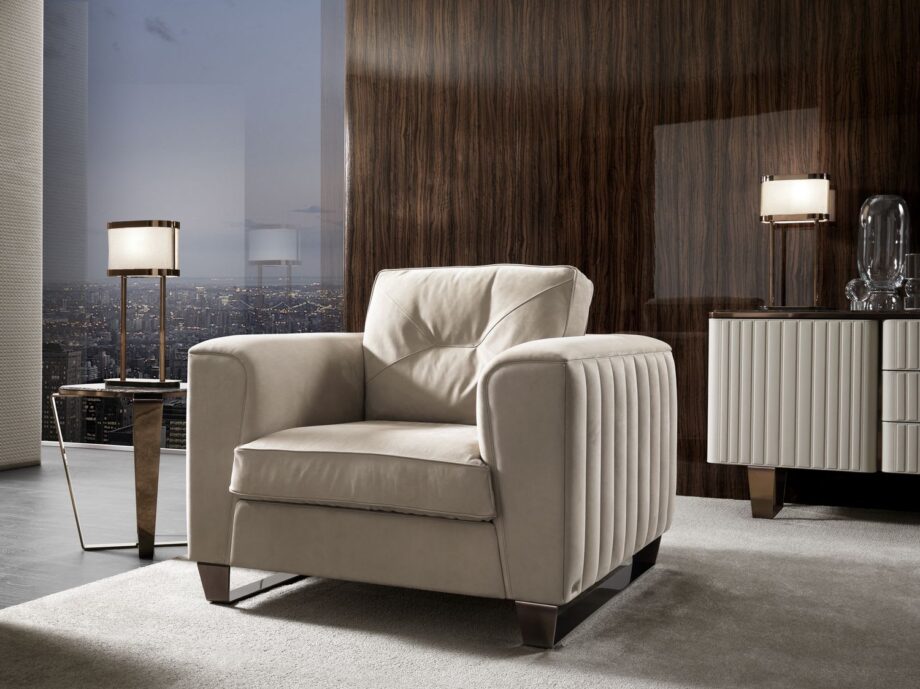 Beverly armchair | DV home. Luxury Art Deco armchair with solid wood frame, goose feather cushions, and elegant metal feet for ultimate comfort.
