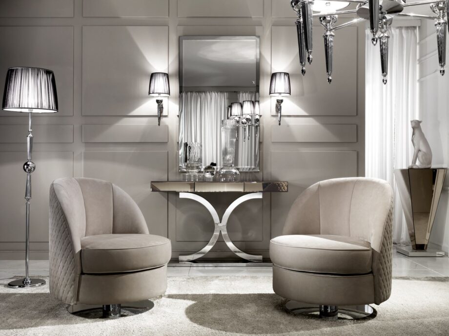 Douglas wall lamp | DV home. An exquisite Art Deco wall lamp featuring shining brass or chrome and a pleated fabric shade, perfect for luxury interiors.