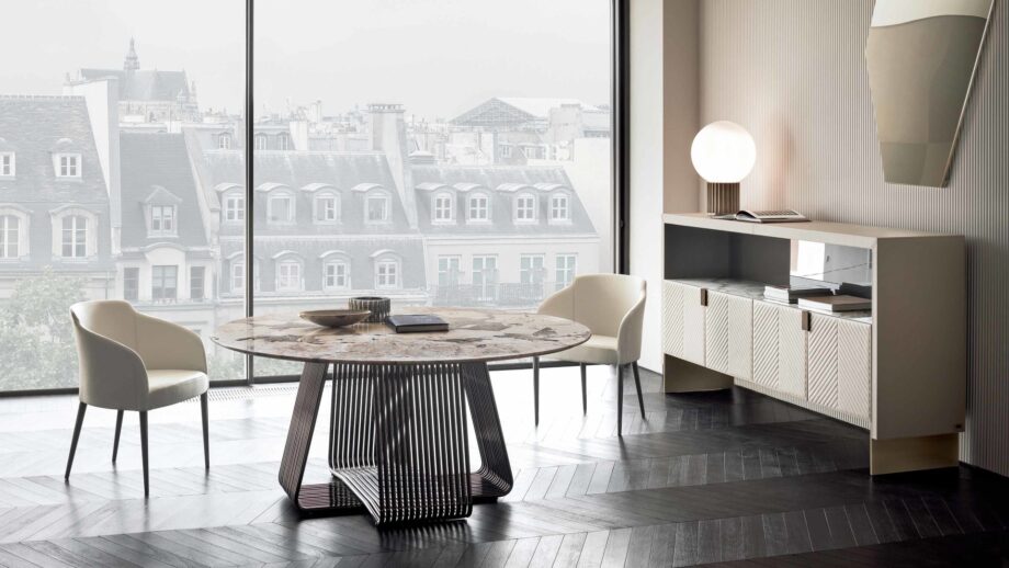 Alyson Round table | Rugiano. Elegant round dining table with a distinctive slatted base, perfect for modern interiors.