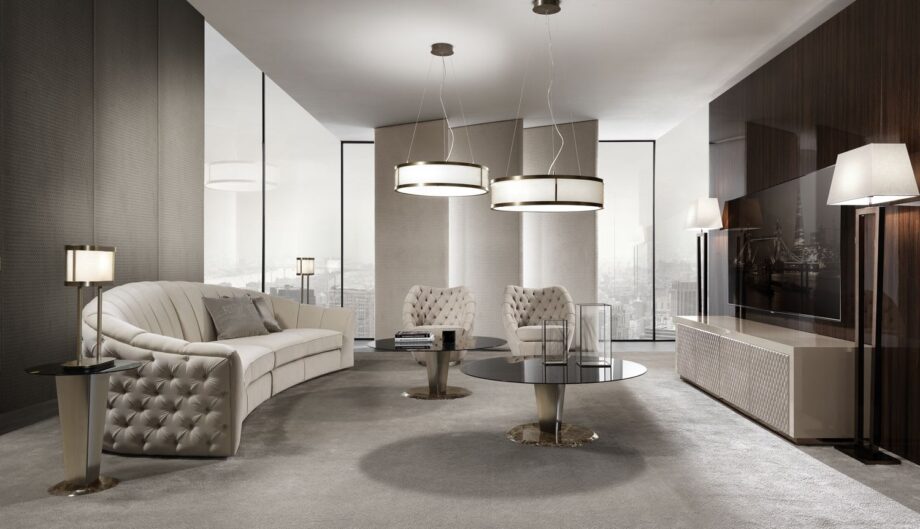 Royal Capitonne' armchair | DV home. Luxurious swivel armchair with exquisite tufted upholstery and a polished steel base.