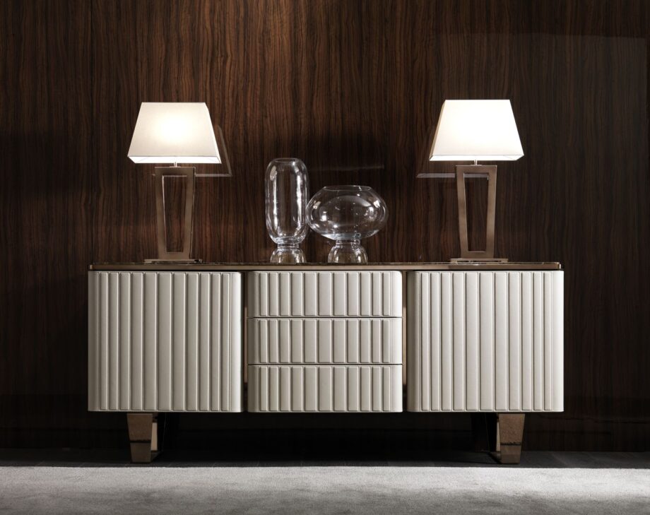 Ritz table lamp | DV home. Elegant Art Deco table lamp with a striking metal base and luxurious fabric shade, perfect for sophisticated interiors.
