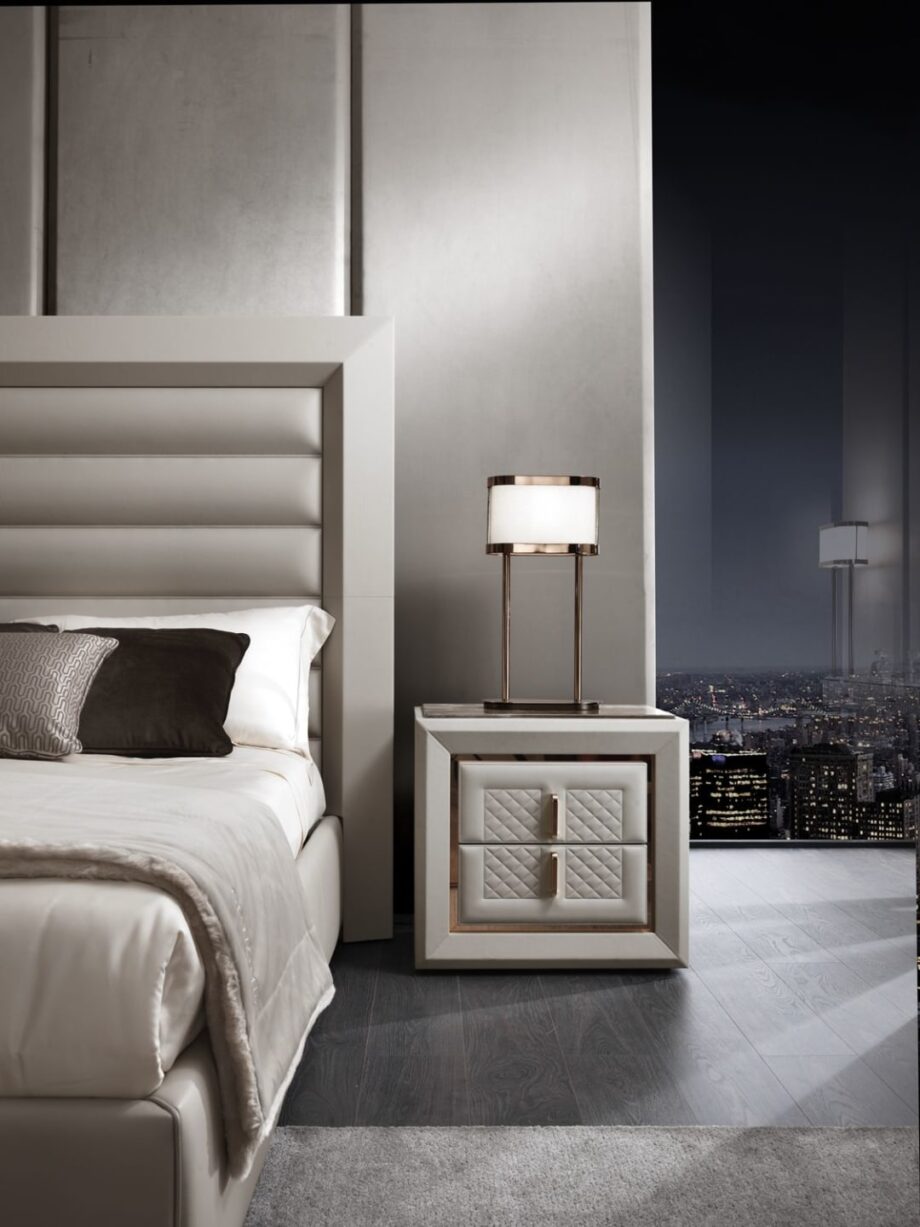 Adler Square bedside table | DV home. Luxury bedside table with leather upholstery, marble top, quilted front panels, and Blumotion soft-close system.