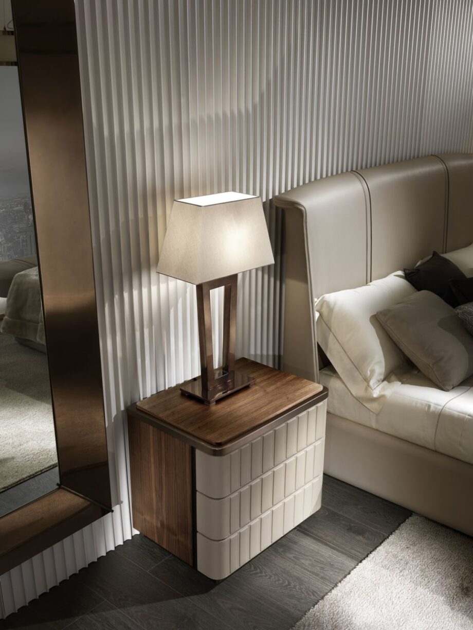 Elite bedside table | DV home. Art Deco bedside table with leather finish and marble top, offering elegance and functionality.