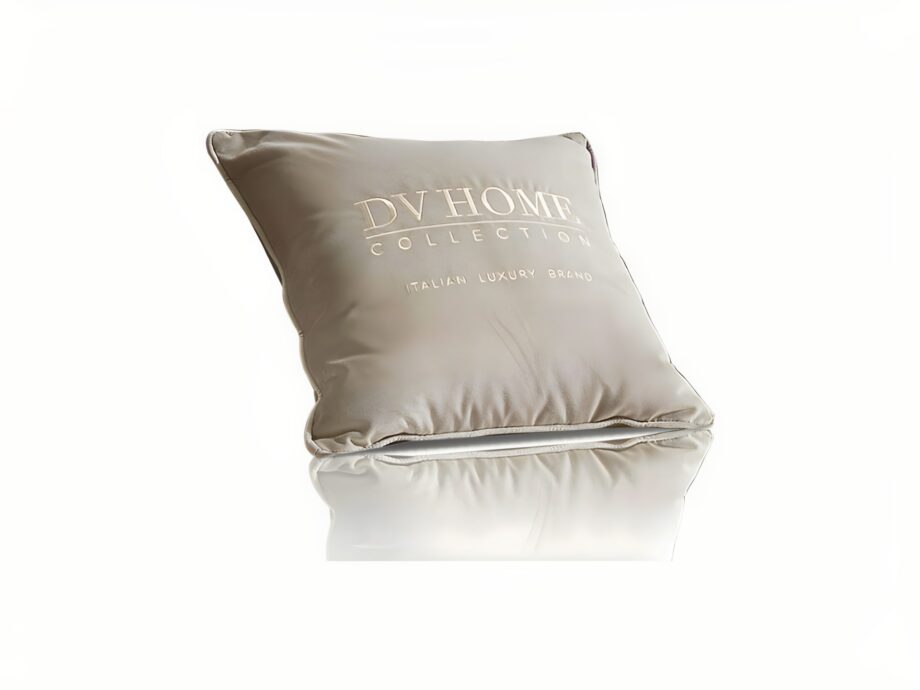 Soft Brand pouf | DV home. Luxurious cushion with goose feather filling and elegant embroidered logo, offering ultimate comfort and style.