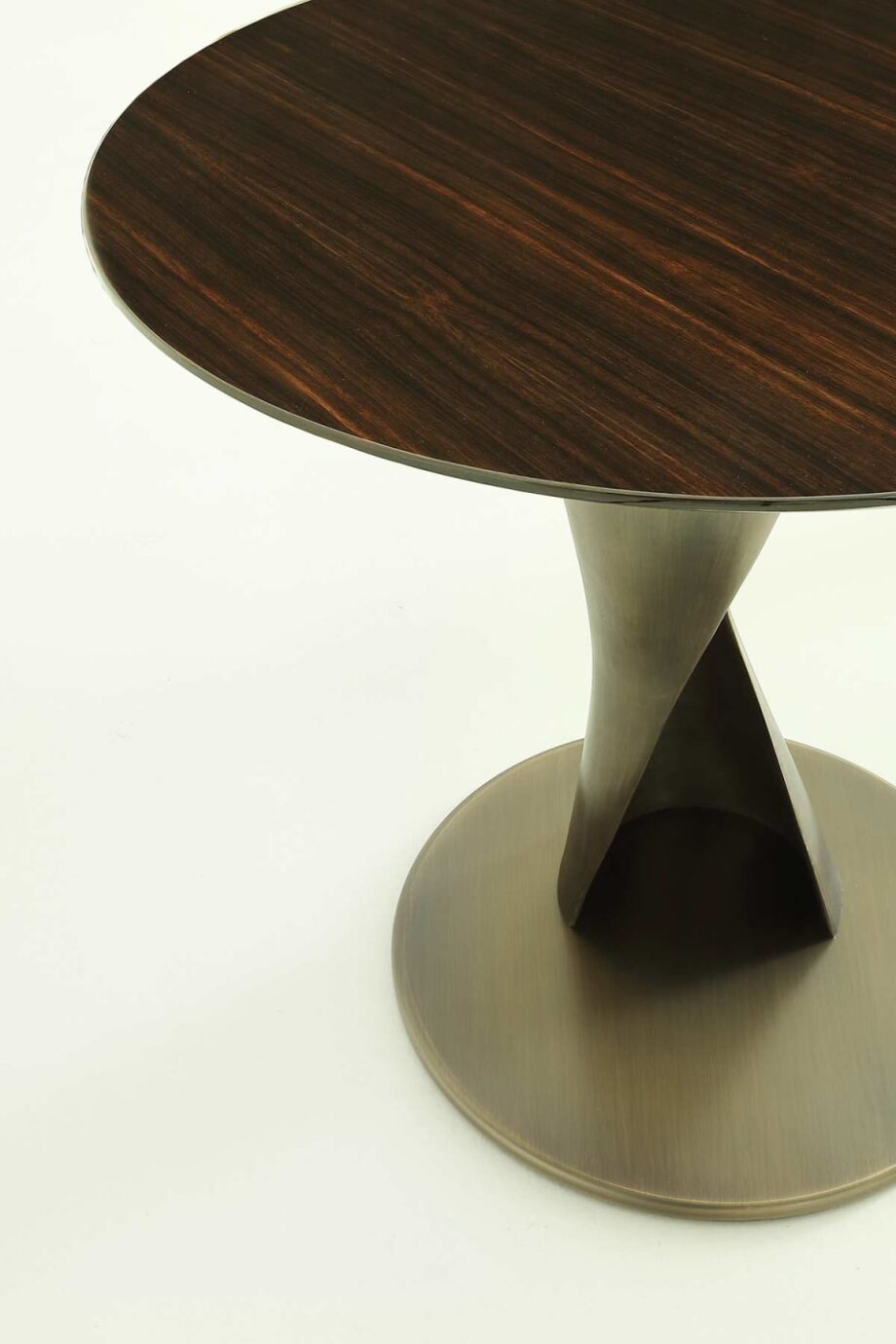 Zoe coffee table | Rugiano. Sculptural coffee table with a bronze fusion base and top in wood, marble, or leather.