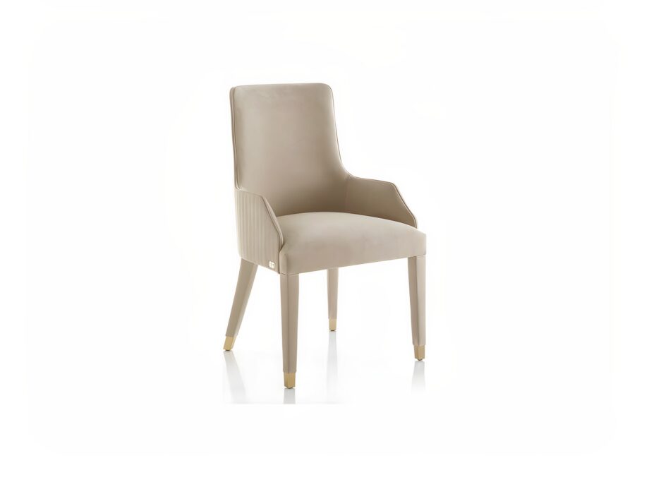 Byron Cannetè chair | DV home. Elegant armchair with a distinctive cannetè back and polished steel feet, offering luxurious comfort.