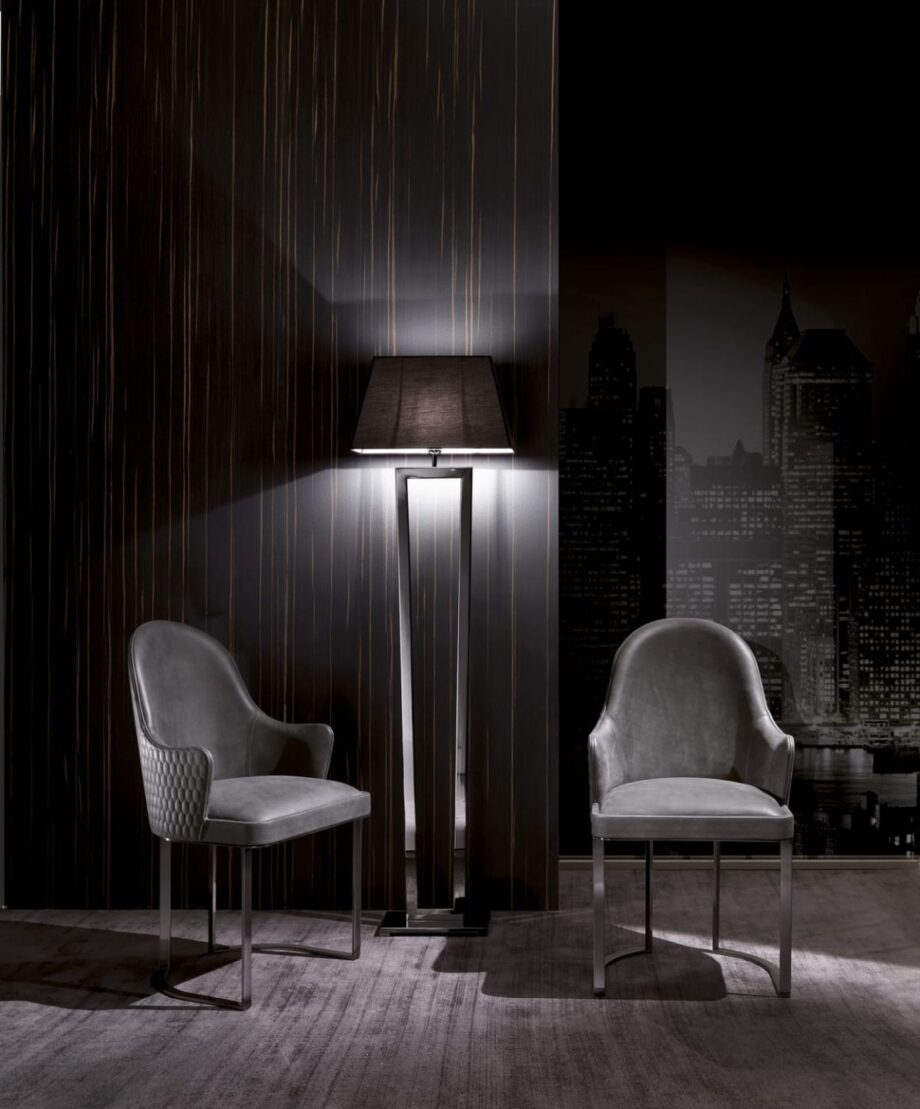 Ritz chair | DV home. Luxurious Art Deco armchair with quilted armrests and a shining chrome base, offering exceptional comfort and style.