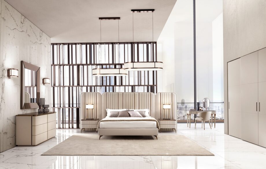 Hollywood Maxi bed | DV home. An opulent Italian luxury bed featuring a striking high upholstered headboard with elegant vertical inserts, perfect for sophisticated bedrooms.