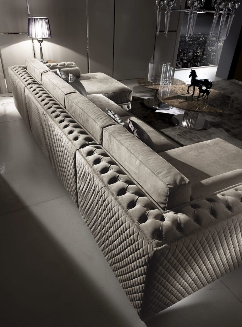 Velvet sofa | DV home. Luxurious Art Deco sofa with tufted upholstery, solid wood frame, goose feather cushions, and chrome feet.
