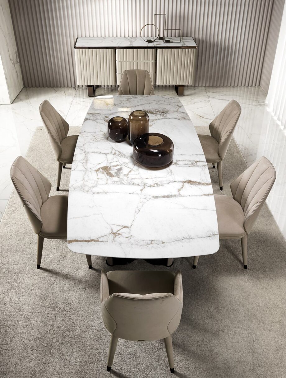 Elite chair | DV home. Luxurious Italian armchair with elegant curves, premium upholstery, and polished steel details, perfect for sophisticated interiors.