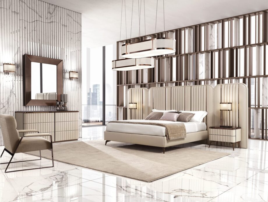 Hollywood Maxi bed | DV home. An opulent Italian luxury bed featuring a striking high upholstered headboard with elegant vertical inserts, perfect for sophisticated bedrooms.