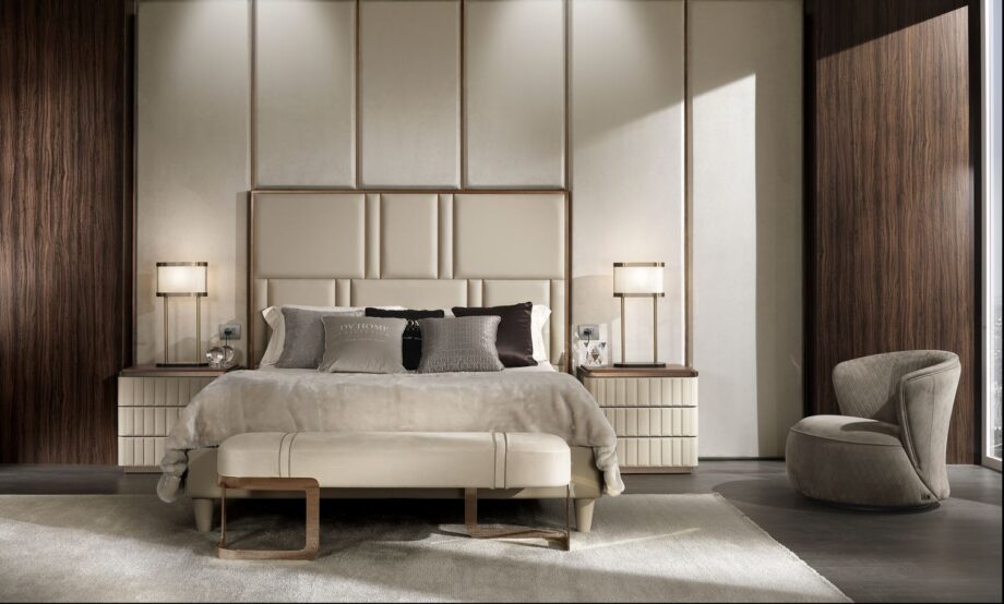 Elite bed | DV home. Elegant bed featuring a high tufted headboard and sophisticated metallic accents, creating an ambiance of luxury and comfort.