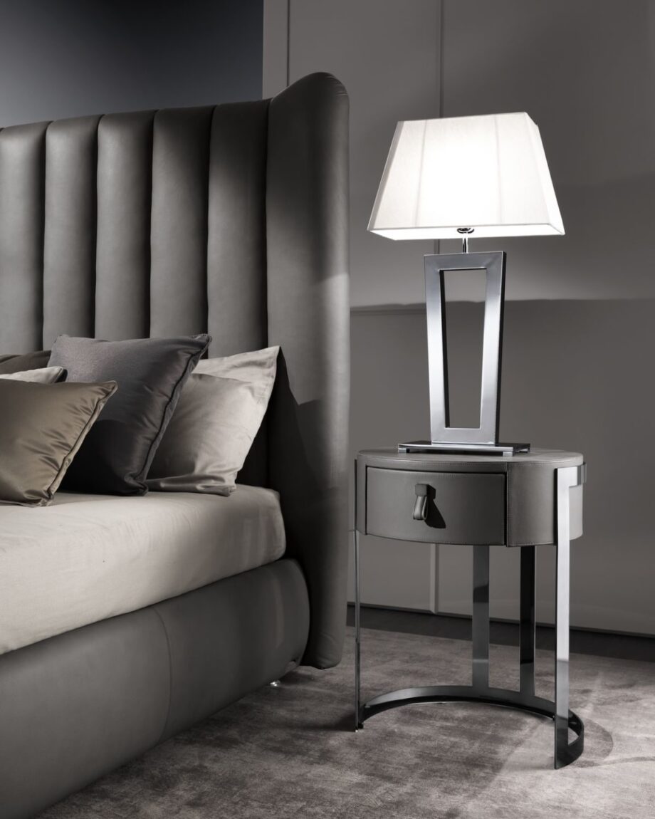 Ritz table lamp | DV home. Elegant Art Deco table lamp with a striking metal base and luxurious fabric shade, perfect for sophisticated interiors.