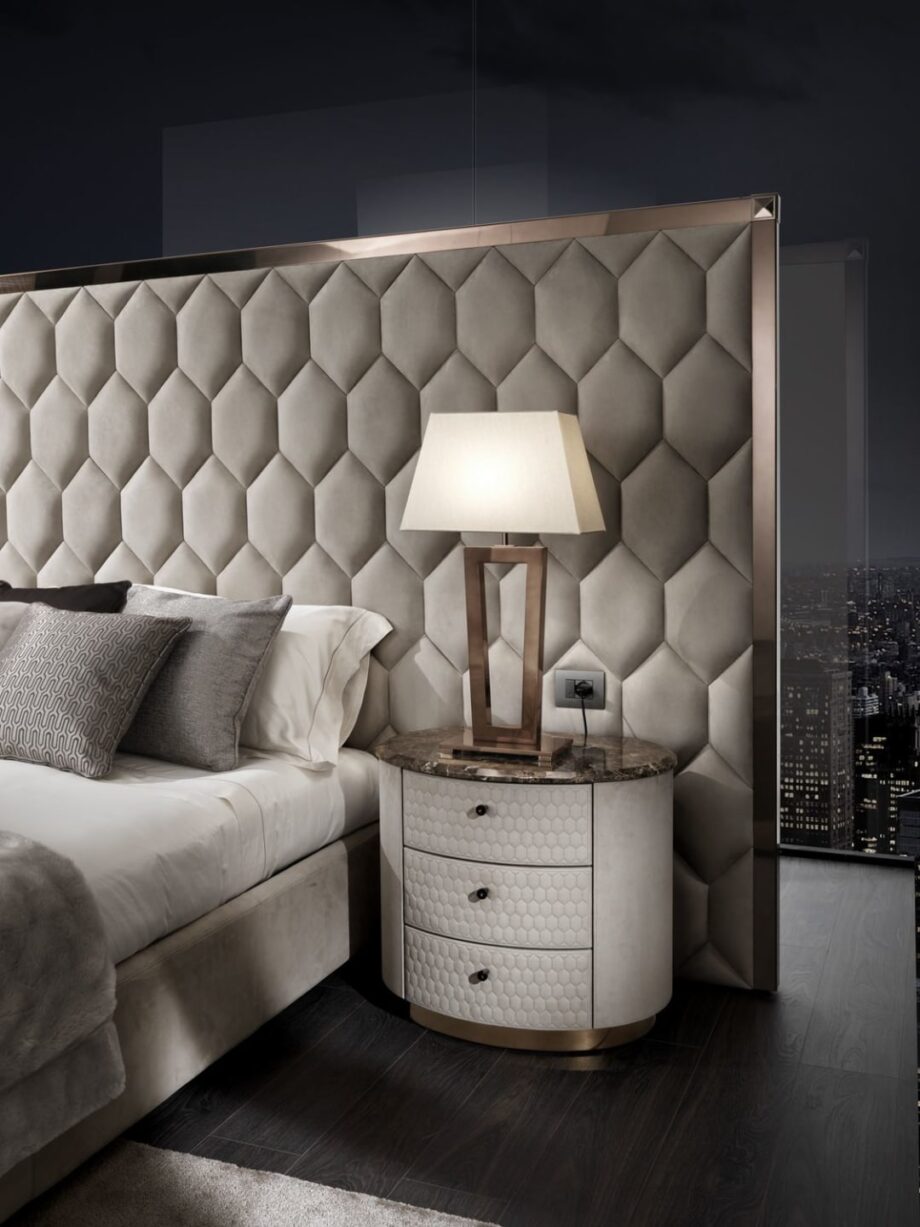 Charlotte bedside table | DV home. Handcrafted luxury night table with hexagon-patterned drawers, premium leather or walnut finishes, and a polished stainless steel base.