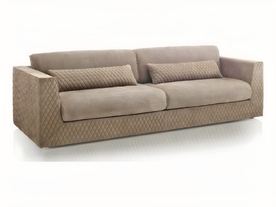 Cooper Quilt sofa | DV home. Luxurious sofa with a distinctive quilted exterior and comfortable long cushions, embodying Italian craftsmanship and contemporary elegance.