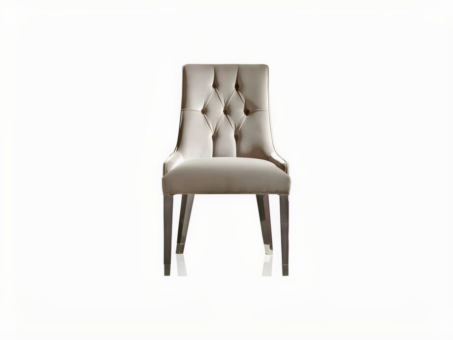 Byron Capitonné chair | DV home. Luxurious tufted armchair with a high back and armrests, perfect for sophisticated interiors.
