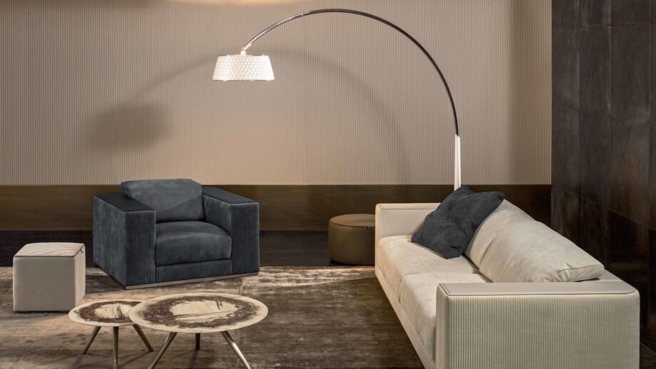 Joanne floor lamp | Rugiano. Elegant floor lamp with a curved metal frame and soft diffused light, perfect for modern interiors.