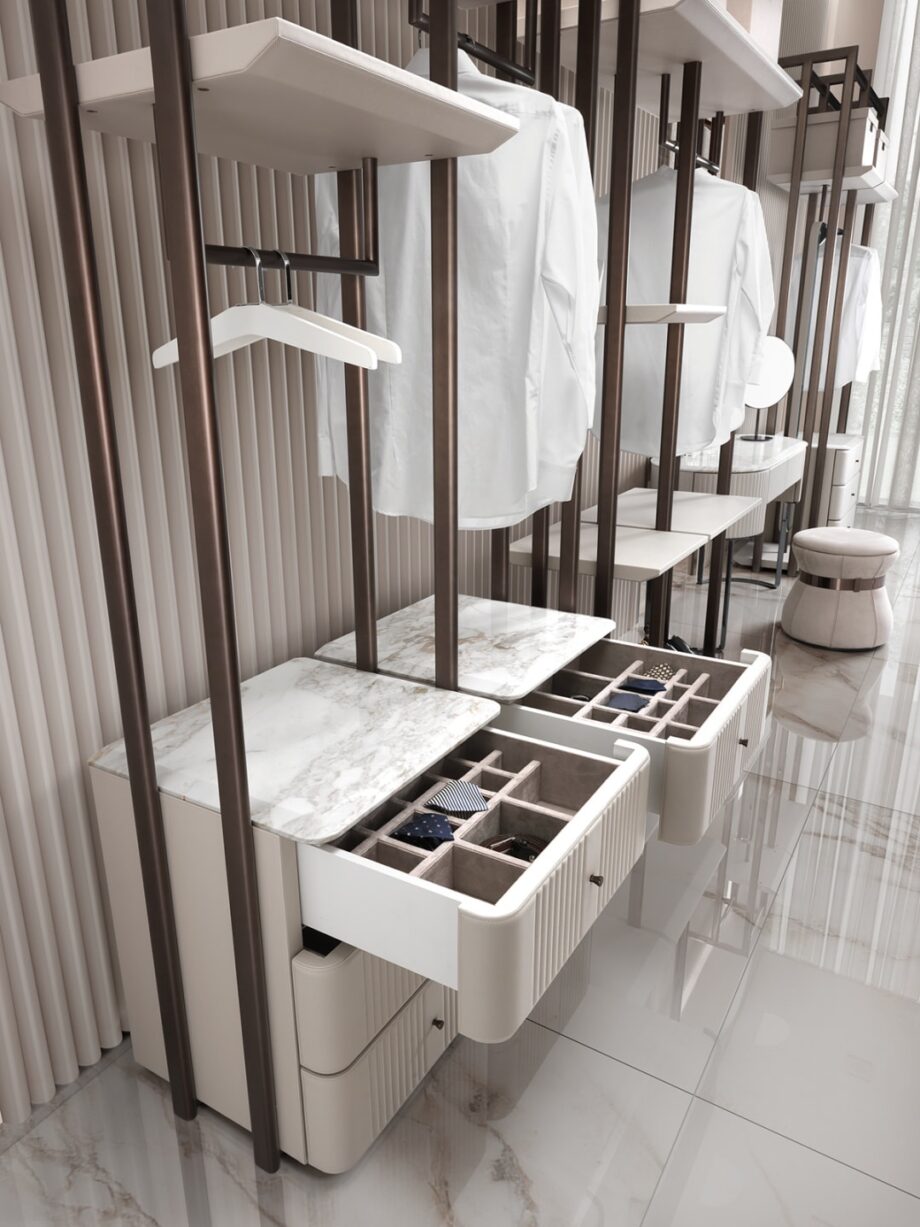 Hollywood closet | DV home. Luxurious Art Deco walk-in closet with brushed stainless steel structure and exquisite leather-covered shelves.