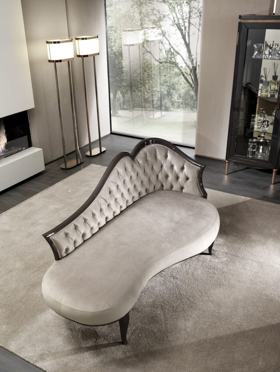 Rene' chaise longue | DV home. Exquisite Art Deco chaise longue with hand-carved lacquered wood frame and luxurious button-tufted upholstery, embodying Italian craftsmanship.