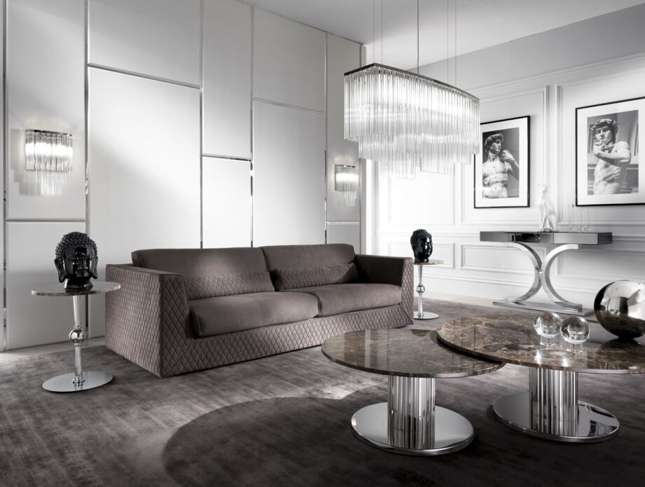 Egoist coffee table | DV home. Elegant Art Deco side table with a shining metal base and luxurious top, perfect for sophisticated interiors.
