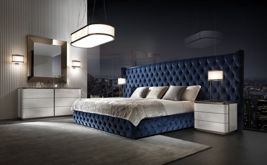 Vogue Maxi bed | DV home. Luxurious bed with a high, tufted headboard, offering unparalleled comfort and a grand, elegant presence.