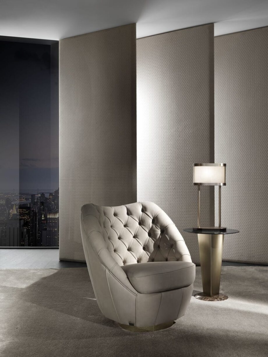 Royal Capitonne' armchair | DV home. Luxurious swivel armchair with exquisite tufted upholstery and a polished steel base.