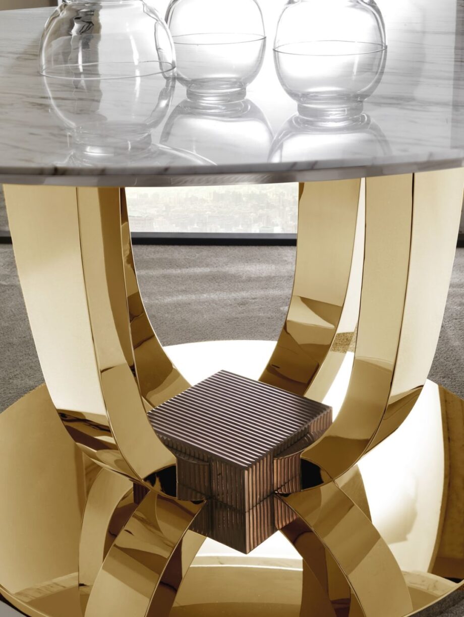 Hermes Round table | DV home. Exquisite Art Deco dining table with a luxurious marble top and a distinctive metal base, perfect for upscale interiors.