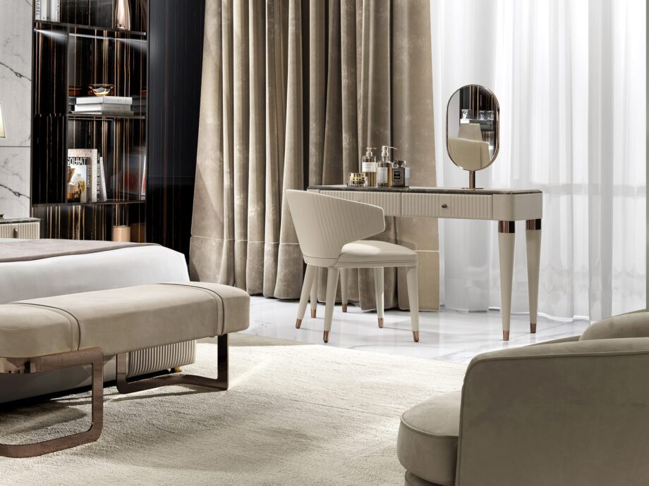Hollywood chair | DV home. Elegant armchair with curved lines and quilted back, embodying luxury and comfort in contemporary Art Deco style.